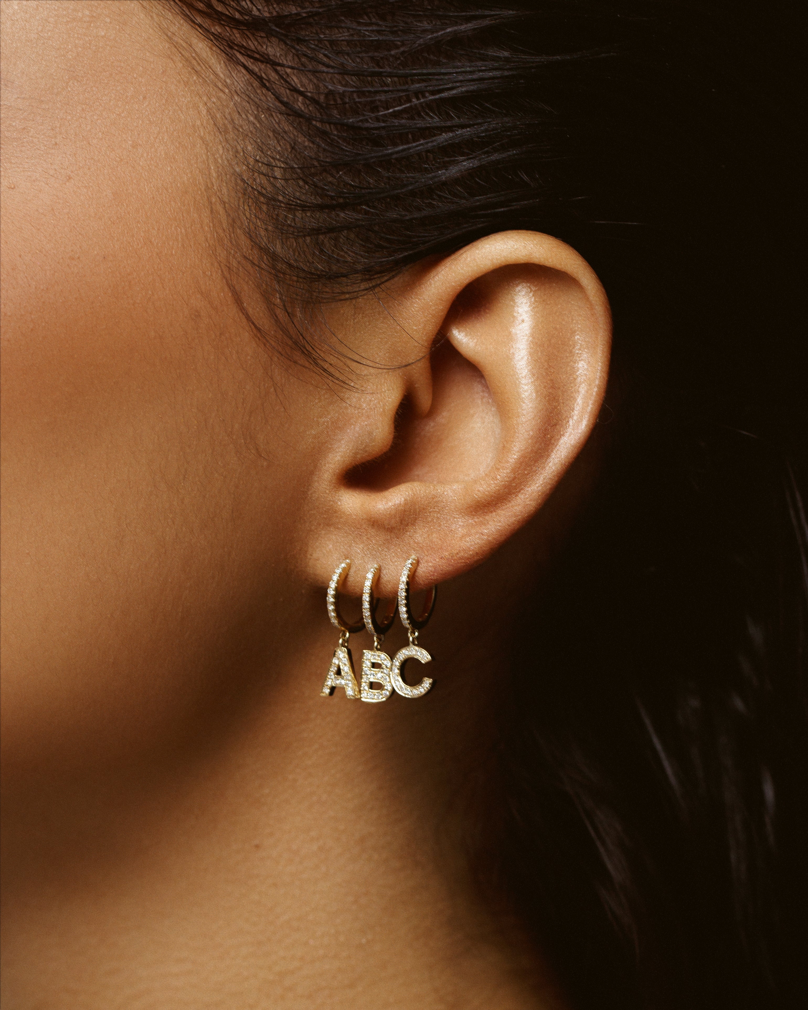 diamond initial huggie earrings